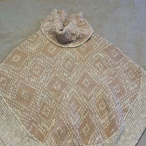 Beautiful poncho. Size small. Never worn. Made in Italy